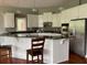 Kitchen with white cabinets, granite countertops, and stainless steel appliances at 2569 Dawn Ridge Dr, Carmel, IN 46074
