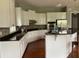 Large kitchen with white cabinets, granite countertops, and an island at 2569 Dawn Ridge Dr, Carmel, IN 46074