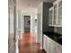 Kitchen with hardwood floors, white cabinets, and granite counters at 2569 Dawn Ridge Dr, Carmel, IN 46074
