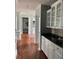 Kitchen with hardwood floors, white cabinets, and granite counters at 2569 Dawn Ridge Dr, Carmel, IN 46074