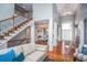 Elegant living room with hardwood floors and staircase at 2569 Dawn Ridge Dr, Carmel, IN 46074