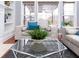 Bright living room features a glass coffee table and comfy sofas at 2569 Dawn Ridge Dr, Carmel, IN 46074