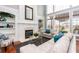 Light-filled living room with fireplace and built-in shelves at 2569 Dawn Ridge Dr, Carmel, IN 46074