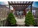 Seating area on patio under pergola at 2569 Dawn Ridge Dr, Carmel, IN 46074