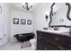 Bathroom with clawfoot tub and antique vanity at 19431 Prairie Baptist Rd, Noblesville, IN 46060