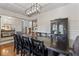 Formal dining room featuring a long wood table and chandelier at 19431 Prairie Baptist Rd, Noblesville, IN 46060