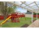 -friendly backyard with playset, shed, and pergola-covered patio at 5321 Basin Park Dr, Indianapolis, IN 46239