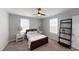 Cozy bedroom with carpeted floor and a ceiling fan at 3058 Ruckle St, Indianapolis, IN 46205