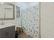 Clean bathroom with shower stall and gray vanity at 412 W 11Th St, Anderson, IN 46016