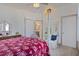 Main bedroom with a four-poster bed, sitting area, and en-suite bathroom at 412 W 11Th St, Anderson, IN 46016