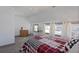 Bright bedroom with a metal bed frame and red/black bedding at 412 W 11Th St, Anderson, IN 46016