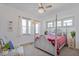 Spacious bedroom with a four-poster bed and plenty of natural light at 412 W 11Th St, Anderson, IN 46016