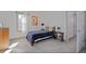 Bedroom with twin bed, plaid bedding, and adjacent closet at 412 W 11Th St, Anderson, IN 46016