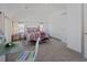 Bright bedroom with a metal bed frame and window seats at 412 W 11Th St, Anderson, IN 46016