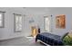 Well-lit bedroom with a twin-sized bed and plaid bedding at 412 W 11Th St, Anderson, IN 46016