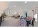 Spacious bonus room with seating area and game table at 412 W 11Th St, Anderson, IN 46016