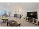 Open concept bonus room with TV, fireplace, and seating area at 412 W 11Th St, Anderson, IN 46016
