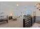Bright and spacious bonus room with a seating area and a view at 412 W 11Th St, Anderson, IN 46016