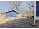New detached garage with white door and blue siding at 412 W 11Th St, Anderson, IN 46016