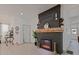 Modern fireplace with dark brick surround and wooden mantel at 412 W 11Th St, Anderson, IN 46016