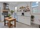 Bright kitchen with white cabinets, granite counters, and farmhouse style island at 412 W 11Th St, Anderson, IN 46016
