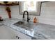Modern kitchen sink with sleek faucet and granite countertop at 412 W 11Th St, Anderson, IN 46016