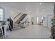 Modern staircase with dark wood accents leading to upper level at 412 W 11Th St, Anderson, IN 46016