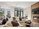 Spacious living room with sectional sofa, fireplace, and large windows at 41 N Rangeline Rd # 2, Carmel, IN 46032