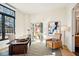 Sunlit home office boasts a large desk and comfortable armchair at 41 N Rangeline Rd # 2, Carmel, IN 46032