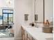 Modern bathroom with double vanity and marble countertops at 41 N Rangeline Rd # 2, Carmel, IN 46032