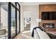 Bright living room features a fireplace and access to a private balcony at 41 N Rangeline Rd # 2, Carmel, IN 46032
