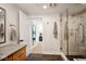 Contemporary bathroom with a walk-in shower and dark tile flooring at 41 N Rangeline Rd # 2, Carmel, IN 46032