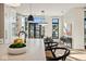 Eat-in kitchen boasts a large island, white cabinetry, and a view of the backyard at 41 N Rangeline Rd # 2, Carmel, IN 46032