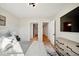 Bedroom with large TV, walk-in closet and access to hallway at 41 N Rangeline Rd # 2, Carmel, IN 46032