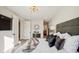 Spacious bedroom with large TV, comfy bed, and stylish decor at 41 N Rangeline Rd # 2, Carmel, IN 46032