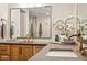 Double vanity bathroom with grey countertops and gold fixtures at 41 N Rangeline Rd # 2, Carmel, IN 46032