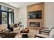 Relaxing living room with a linear fireplace and built-in shelving at 41 N Rangeline Rd # 2, Carmel, IN 46032