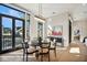 Bright dining area with large windows and modern round table at 41 N Rangeline Rd # 2, Carmel, IN 46032