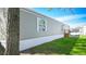 Tan mobile home with white trim and small deck at 31 Blue Water Dr, Cicero, IN 46034