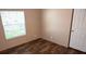 Simple bedroom with wood-look floors, window, and neutral walls at 31 Blue Water Dr, Cicero, IN 46034