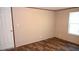 Empty bedroom with wood-look floors, window, and neutral walls at 31 Blue Water Dr, Cicero, IN 46034
