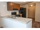Modern kitchen featuring granite countertops, stainless steel sink, and dark appliances at 31 Blue Water Dr, Cicero, IN 46034