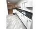 Modern kitchen with white cabinets and dark countertops at 2620 Brookway St, Indianapolis, IN 46218