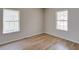 Well-lit bedroom featuring hardwood floors and neutral walls at 3027 Guilford Ave, Indianapolis, IN 46205