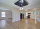 Open concept kitchen and dining area with stainless steel appliances and hardwood floors at 3027 Guilford Ave, Indianapolis, IN 46205