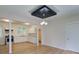 Open concept kitchen and dining area with stainless steel appliances and hardwood floors at 3027 Guilford Ave, Indianapolis, IN 46205