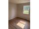 Bright bedroom featuring hardwood floors and a window at 4899 N 500 W, Bargersville, IN 46106