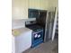 Modern kitchen with teal appliances and ample storage at 4899 N 500 W, Bargersville, IN 46106