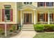 Inviting two-story home featuring a charming front porch and landscaping at 1104 W Greencastle Road, Mooresville, IN 46158