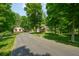 Long driveway leading to a two-story house and detached garage at 1104 W Greencastle Road, Mooresville, IN 46158